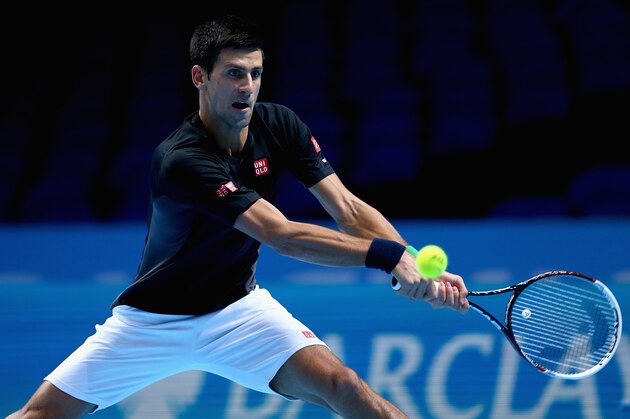 LONDON, ENGLAND - NOVEMBER 08:  Novak Djokovic of Serbia plays a backhand in practice during the Barclays ATP World Tour Finals tennis previews at the O2 Arena on November 8, 2014 in London, England.  (Photo by Clive Brunskill/Getty Images)