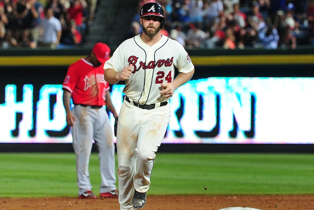 ATLANTA, GA - JUNE 14: Evan Gattis #24 of the Atlanta Braves rounds the bases after hitting an 8th inning solo home run against the Los Angeles Angels of Anaheim at Turner Field on June 14, 2014 in Atlanta, Georgia. (Photo by Scott Cunningham/Getty Images)