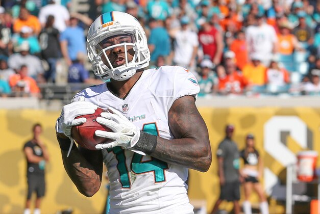 Miami Dolphins Jarvis Landry (14) catches a Jacksonville Jaguars punt during the second half of an NFL football game in Jacksonville, Fla., Sunday, Oct. 26, 2014. Miami won 27-13. (AP Photo/Gary McCullough)