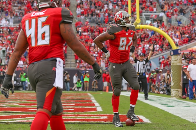 TAMPA, FL - NOVEMBER 09: Austin Seferian-Jenkins #87 of the Tampa Bay Buccaneers poses with the ball as a prop after scoring a touchdown during the second half of the game against the Atlanta Falcons at Raymond James Stadium on November 9, 2014 in Tampa, Florida.  (Photo by Mike Ehrmann/Getty Images)