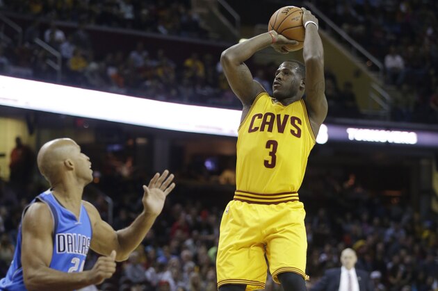 Cleveland Cavaliers' Dion Waiters (3) shoots against the Dallas Mavericks in a preseason NBA basketball game Friday, Oct. 17, 2014, in Cleveland. (AP Photo/Mark Duncan)