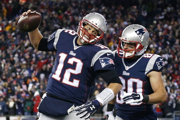 New England Patriots quarterback Tom Brady (12) celebrates with wide receiver Danny Amendola (80) in the first half of an NFL football game against the Denver Broncos on Sunday, Nov. 2, 2014, in Foxborough, Mass. (AP Photo/Elise Amendola)