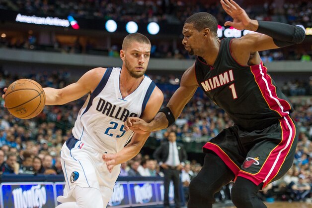 Nov 9, 2014; Dallas, TX, USA; Dallas Mavericks forward Chandler Parsons (25) drives to the basket past Miami Heat center Chris Bosh (1) during the first quarter at the American Airlines Center. Mandatory Credit: Jerome Miron-USA TODAY Sports
