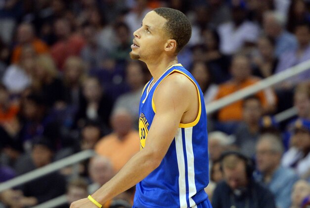 Nov 9, 2014; Phoenix, AZ, USA; Golden State Warriors guard Stephen Curry (30) shows his frustrations against the Phoenix Suns during the second half at US Airways Center. The Suns won 107-95. Mandatory Credit: Joe Camporeale-USA TODAY Sports