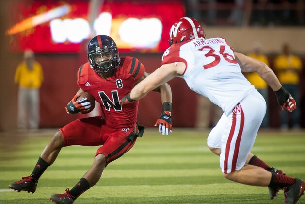 LINCOLN, NE - SEPTEMBER 29: Running back Ameer Abdullah #8 of the Nebraska Cornhuskers runs through the Wisconsin Badgers at Memorial Stadium on September 29, 2012 in Lincoln, Nebraska. Nebraska won 30-27. (Photo by Eric Francis/Getty Images)