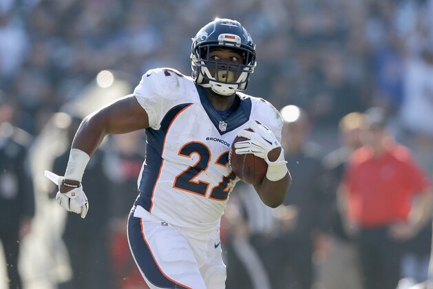 OAKLAND, CA - NOVEMBER 09:  C.J. Anderson #22 of the Denver Broncos carries for a touchdown in the first half against the Oakland Raiders at O.co Coliseum on November 9, 2014 in Oakland, California.  (Photo by Ezra Shaw/Getty Images)