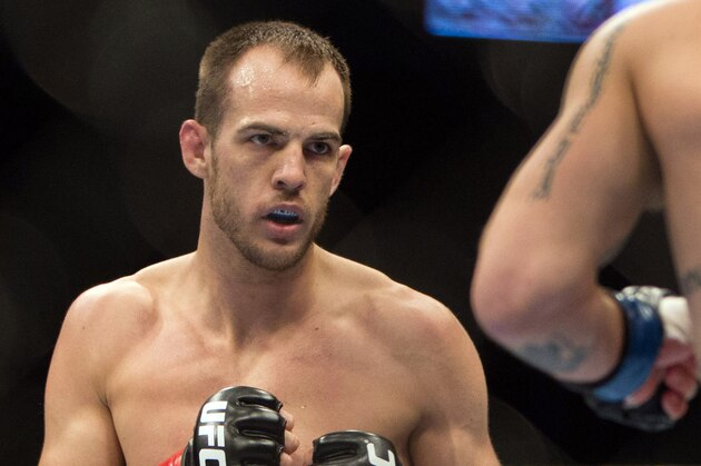 Jan 15, 2014; Duluth, GA, USA;  Cole Miller (red gloves) fights Sam Sicilia (blue gloves) during UFC Fight Night at Gwinnett Center. Miller won. Mandatory Credit: Joshua S. Kelly-USA TODAY Sports