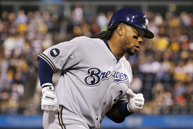 Milwaukee Brewers' Rickie Weeks rounds third after hitting a solo home run off Pittsburgh Pirates starting pitcher Jeff Locke during the fifth inning of a baseball game in Pittsburgh Friday, Sept. 19, 2014. (AP Photo/Gene Puskar)