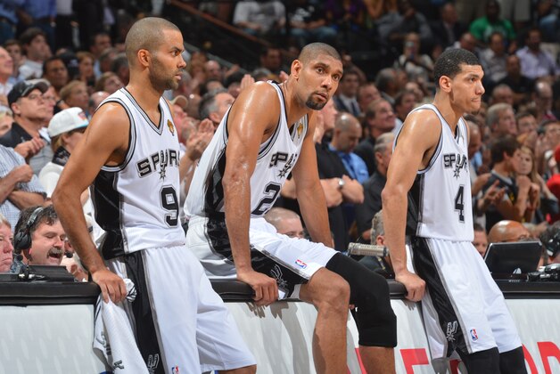 SAN ANTONIO, TX - JUNE 13: Tony Parker #9, Tim Duncan #21 and Danny Green #4 of the San Antonio Spurs waits to check in against the Miami Heat during Game Four of the 2013 NBA Finals on June 13, 2013 at AT&T Center in San Antonio, Texas.  NOTE TO USER: User expressly acknowledges and agrees that, by downloading and or using this photograph, User is consenting to the terms and conditions of the Getty Images License Agreement. Mandatory Copyright Notice: Copyright 2013 NBAE (Photo by Jesse D. Garrabrant/NBAE via Getty Images)