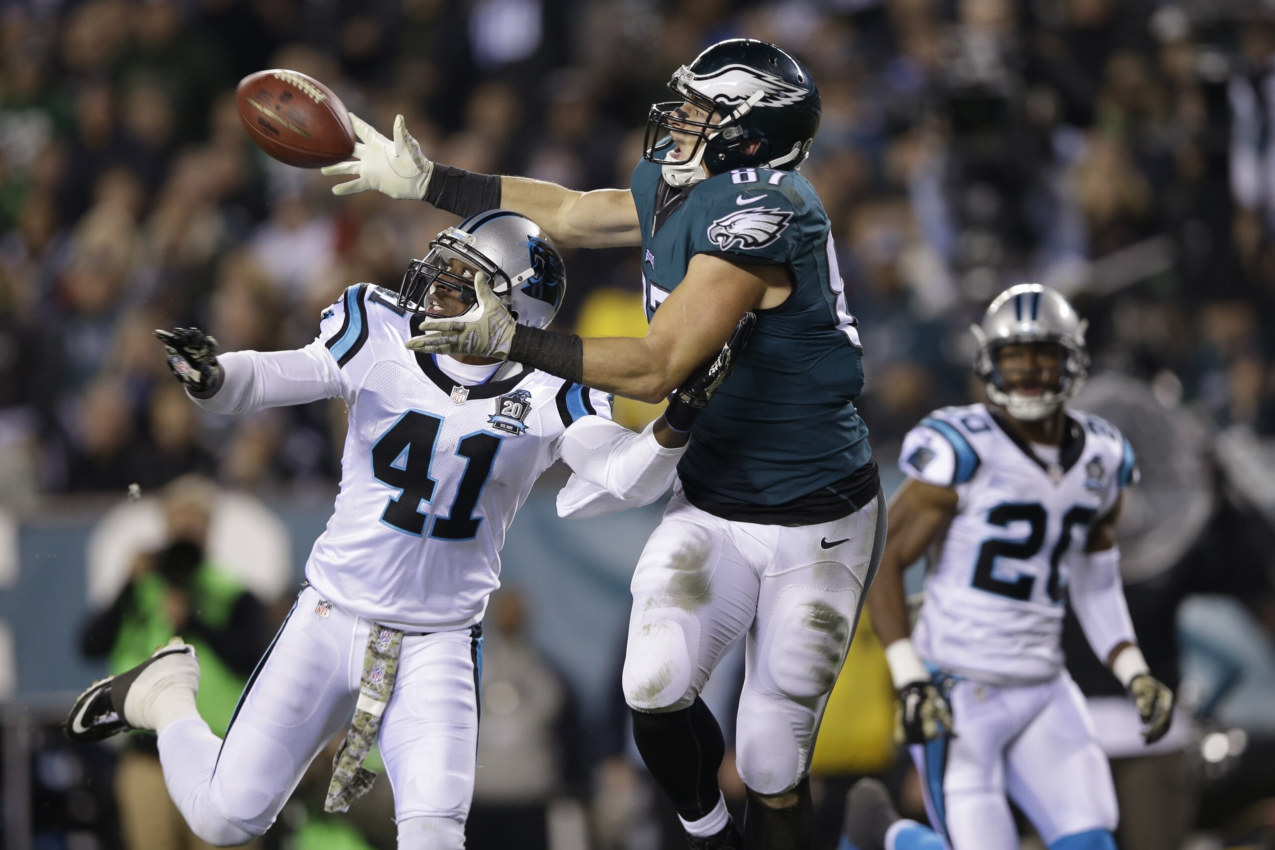 Philadelphia Eagles' Brent Celek (87) pulls in a pass against Carolina Panthers' Roman Harper (41) during the second half of an NFL football game, Monday, Nov. 10, 2014, in Philadelphia. (AP Photo/Michael Perez)