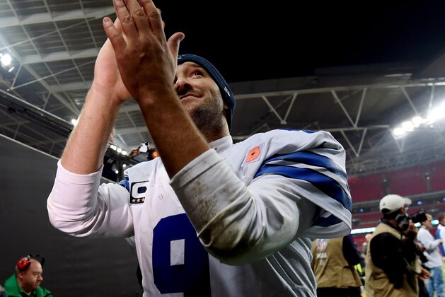 Dallas Cowboys quarterback Tony Romo (9) applauds spectators following the NFL football game against the Jacksonville Jaguars at Wembley Stadium, London, Sunday, Nov. 9, 2014. The Cowboys defeated the Jaguars 31-17. (AP Photo/Tim Ireland)
