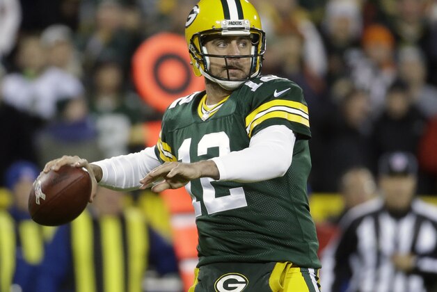 Green Bay Packers quarterback Aaron Rodgers (12) throws a pass during the first half of an NFL football game against the Chicago Bears Sunday, Nov. 9, 2014, in Green Bay, Wis. (AP Photo/Morry Gash)