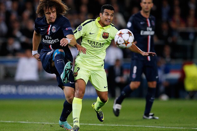 PARIS, FRANCE - SEPTEMBER 30:  David Luiz of PSG clears the ball away from Pedro of Barcelona during the Group F UEFA Champions League match between Paris Saint-Germain v FC Barcelona held at Parc des Princes on September 30, 2014 in Paris, France.  (Photo by Dean Mouhtaropoulos/Getty Images)