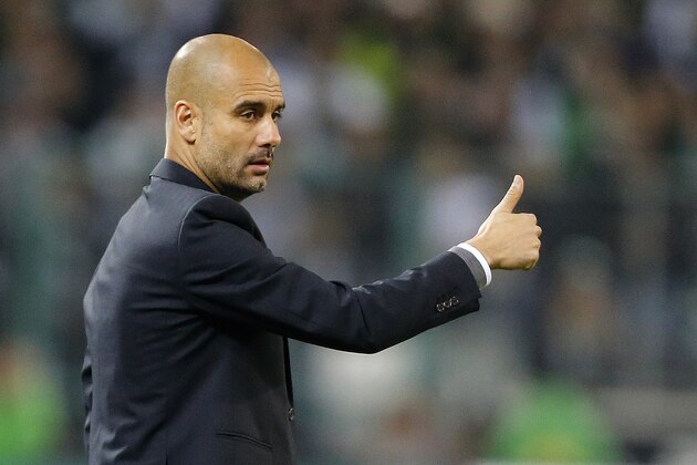 Bayern's head coach Pep Guardiola gestures during the German first division Bundesliga soccer match between Borussia Moenchengladbach and Bayern Munich in Moenchengladbach, Germany, Sunday, Oct. 26, 2014. (AP Photo/Frank Augstein)