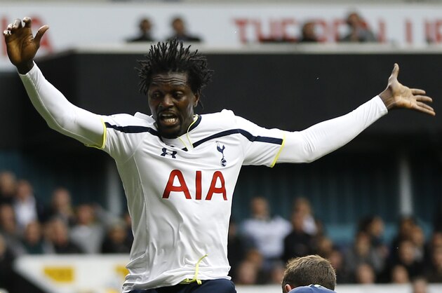 Tottenham's Emmanuel Adebayor vies for the ball with Newcastle's Paul Dummett during the English Premier League soccer match between Tottenham Hotspur and Newcastle United at White Hart Lane stadium in London, Sunday, Oct. 26, 2014. (AP Photo/Kirsty Wigglesworth)