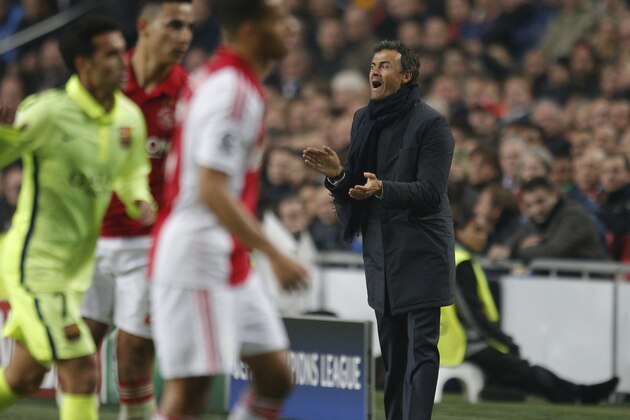 Barcelona's head coach Luis Enrique gives instructions to his players during the Group F Champions League match between AFC Ajax and FC Barcelona at ArenA stadium in Amsterdam, Netherlands, Wednesday, Nov. 5, 2014. (AP Photo/Peter Dejong)