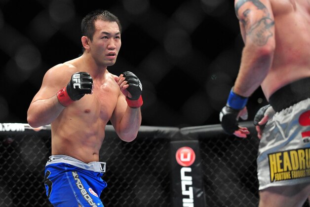 Dec 29, 2012; Las Vegas, NV, USA; Yushin Okami (right) and Alan Belcher (right) during UFC 155 at the MGM Grand Garden Arena. Mandatory Credit: Gary A. Vasquez-USA TODAY Sports