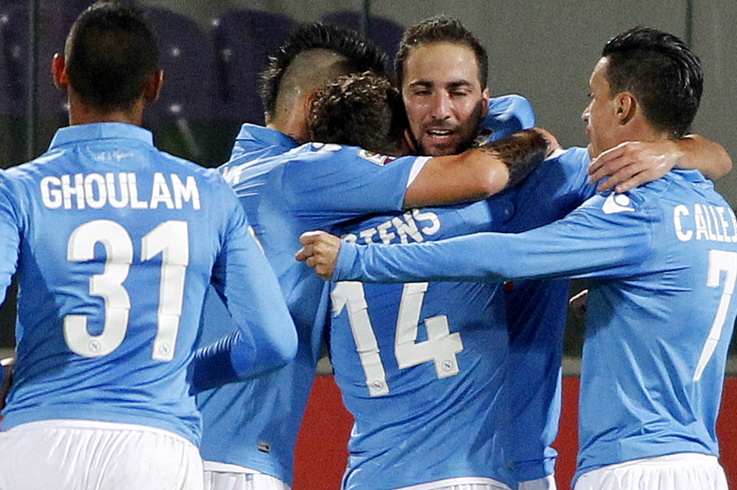 Napoli's Gonzalo Higuain, second from right, celebrates with teamamtes after scoring during a Serie A soccer match between Fiorentina and Napoli at the Artemio Franchi stadium in Florence, Italy, Sunday, Nov. 9  2014. (AP Photo/Fabrizio Giovannozzi)