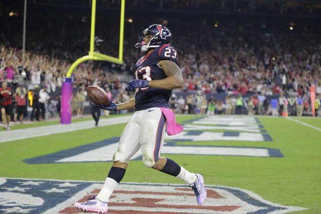 Houston Texans running back Arian Foster (23) scores a touchdown during the second quarter of an NFL football game, Thursday, Oct. 9, 2014, in Houston. (AP Photo/Patric Schneider)