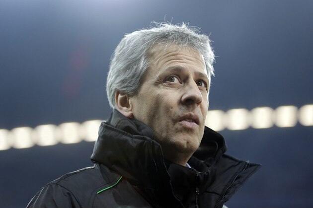 Moenchengladbach head coach Lucien Favre of Switzerland arrives the stadium prior to the German first division Bundesliga soccer match between FC Bayern Munich and Borussia Moenchengladbach, in Munich, southern Germany, Friday, Dec. 14, 2012. (AP Photo/Matthias Schrader)