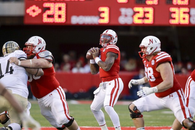 Nebraska quarterback Tommy Armstrong Jr., center, prepares to throw in the second half of an NCAA college football game against Purdue in Lincoln, Neb., Saturday, Nov. 1, 2014. Nebraska won 45-14. (AP Photo/Nati Harnik)