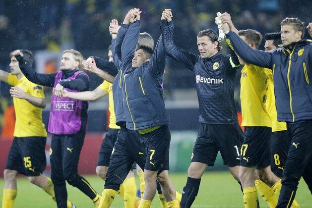 Dortmund players celebrate after the Champions League group D soccer match between Borussia Dortmund and Galatasaray Istanbul in Dortmund, Germany, Tuesday, Nov.4, 2014. (AP Photo/Frank Augstein)