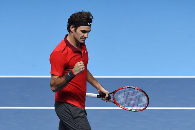 Switzerland’s Roger Federer reacts after winning against Japan’s Kei Nishikori during their singles ATP World Tour tennis finals match at the O2 arena in London, Tuesday, Nov. 11, 2014. (AP Photo/Tim Ireland)