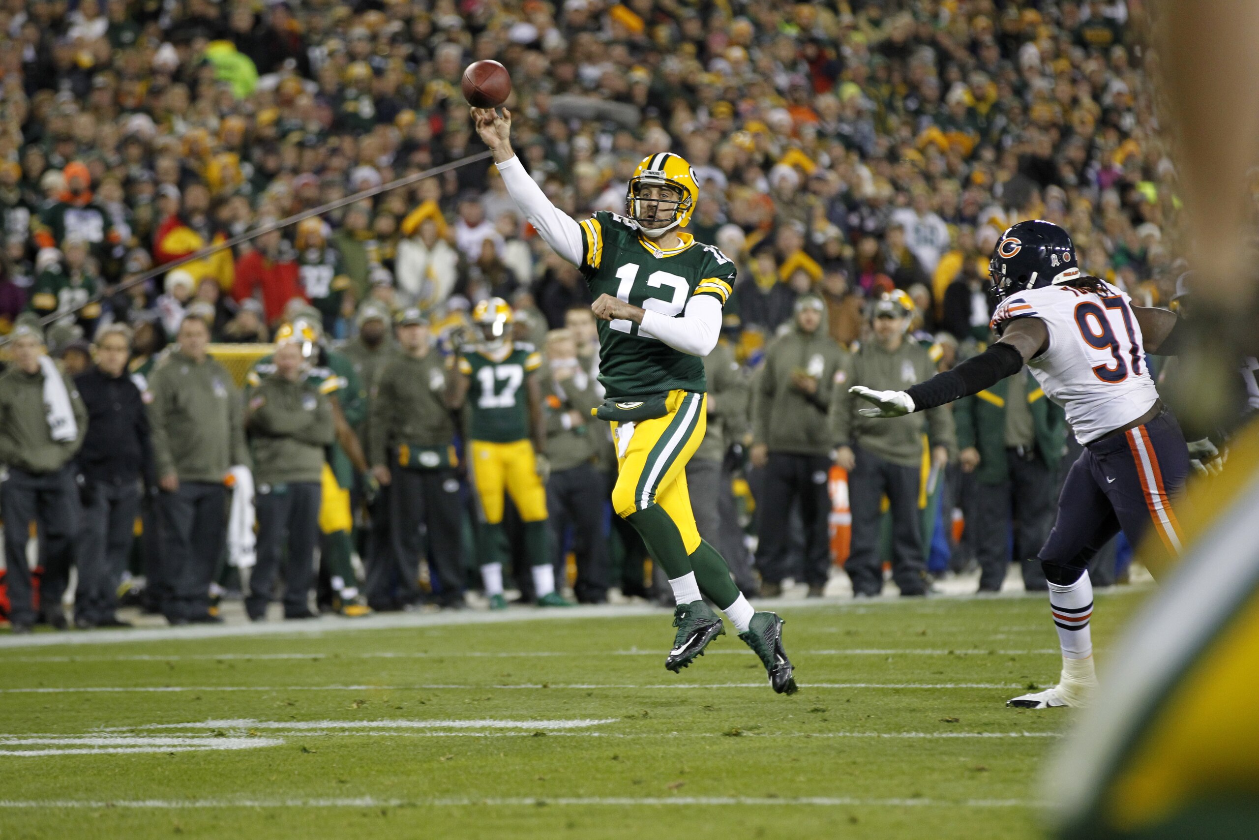 Green Bay Packers quarterback Aaron Rodgers (12) throws a pass during the first half of an NFL football game against the Chicago Bears Sunday, Nov. 9, 2014, in Green Bay, Wis. (AP Photo/Mike Roemer)