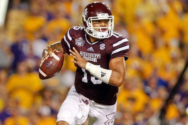 Sep 20, 2014; Baton Rouge, LA, USA; Mississippi State Bulldogs quarterback Dak Prescott (15) looks to pass against the LSU Tigers during the third quarter of a game at Tiger Stadium. Mandatory Credit: Derick E. Hingle-USA TODAY Sports