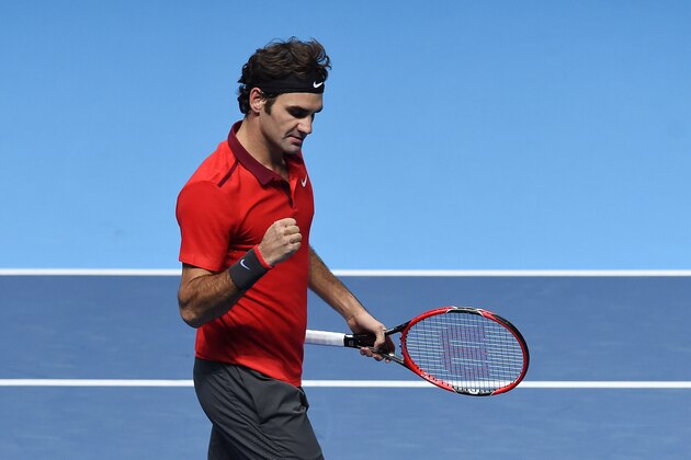 Switzerland’s Roger Federer reacts after winning against Japan’s Kei Nishikori during their singles ATP World Tour tennis finals match at the O2 arena in London, Tuesday, Nov. 11, 2014. (AP Photo/Tim Ireland)