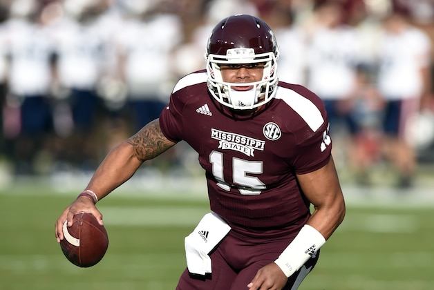 Nov 8, 2014; Starkville, MS, USA; Mississippi State Bulldogs quarterback Dak Prescott (15) scrambles out of the pocket to pass against the UT Martin Skyhawks during the first quarter at Davis Wade Stadium. Mandatory Credit: John David Mercer-USA TODAY Sports