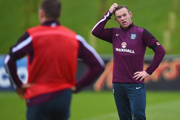 BURTON-UPON-TRENT, ENGLAND - NOVEMBER 11:  Wayne Rooney looks thoughtful during an England training session, ahead of the UEFA European Championship qualifier against Slovenia, at St Georges Park on November 11, 2014 in Burton-upon-Trent, England.  (Photo by Shaun Botterill/Getty Images)