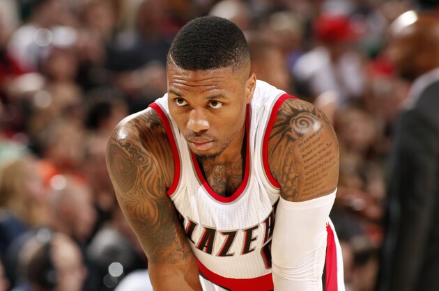 PORTLAND, OR - NOVEMBER 9: Damian Lillard #0 of the Portland Trail Blazers stands on the court during a game against the Denver Nuggets on November 9, 2014 at the Moda Center Arena in Portland, Oregon. NOTE TO USER: User expressly acknowledges and agrees that, by downloading and or using this photograph, user is consenting to the terms and conditions of the Getty Images License Agreement. Mandatory Copyright Notice: Copyright 2014 NBAE (Photo by Cameron Browne/NBAE via Getty Images)