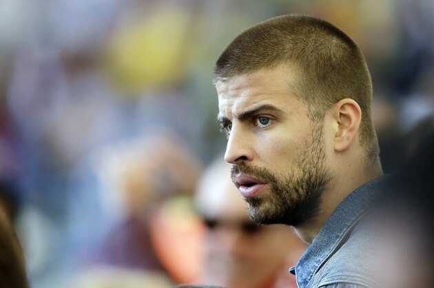 Spain's soccer player Gerard Pique attends the World Cup final soccer match between Germany and Argentina at the Maracana Stadium in Rio de Janeiro, Brazil, Sunday, July 13, 2014. (AP Photo/Themba Hadebe)
