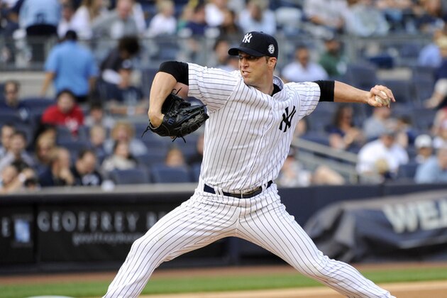 New York Yankees pitcher Chris Capuano delivers the ball to the Toronto Blue Jays during the second inning of a baseball game Saturday, Sept. 20, 2014, at Yankee Stadium in New York. (AP Photo/Bill Kostroun)