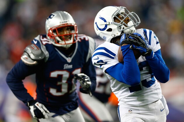 FOXBORO, MA - NOVEMBER 18: T.Y. Hilton #13 of the Indianapolis Colts catches a pass before running in for the touchdown in front of Aqib Talib #31 of the New England Patriots during the game on November 18, 2012 at Gillette Stadium in Foxboro, Massachusetts.  (Photo by Jared Wickerham/Getty Images)