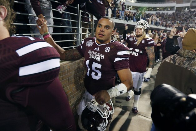 Mississippi State quarterback Dak Prescott (15) thanks fans following their victory over Arkansas in their NCAA college football game in Starkville, Miss., Saturday, Nov. 1, 2014. No. 1 Mississippi State won 17-10. (AP Photo/Rogelio V. Solis)