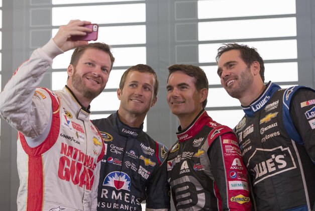 Sep 11, 2014; Chicago, IL, USA; NASCAR Sprint Cup Series drivers Dale Earnhardt Jr. and Kasey Kahne and Jeff Gordon and Jimmie Johnson take a selfie photo during media day for the 2014 Chase for the NASCAR Sprint Cup at The Murphy Chicago. Mandatory Credit: Jasen Vinlove-USA TODAY Sports