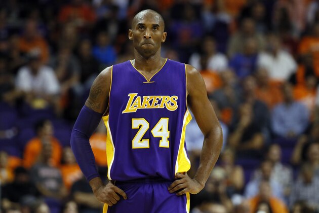 Los Angeles Lakers guard Kobe Bryant (24) walks up court during the second half of an NBA basketball game against the Phoenix Suns, Wednesday, Oct. 29, 2014, in Phoenix. The Suns won 119-99. (AP Photo/Matt York)