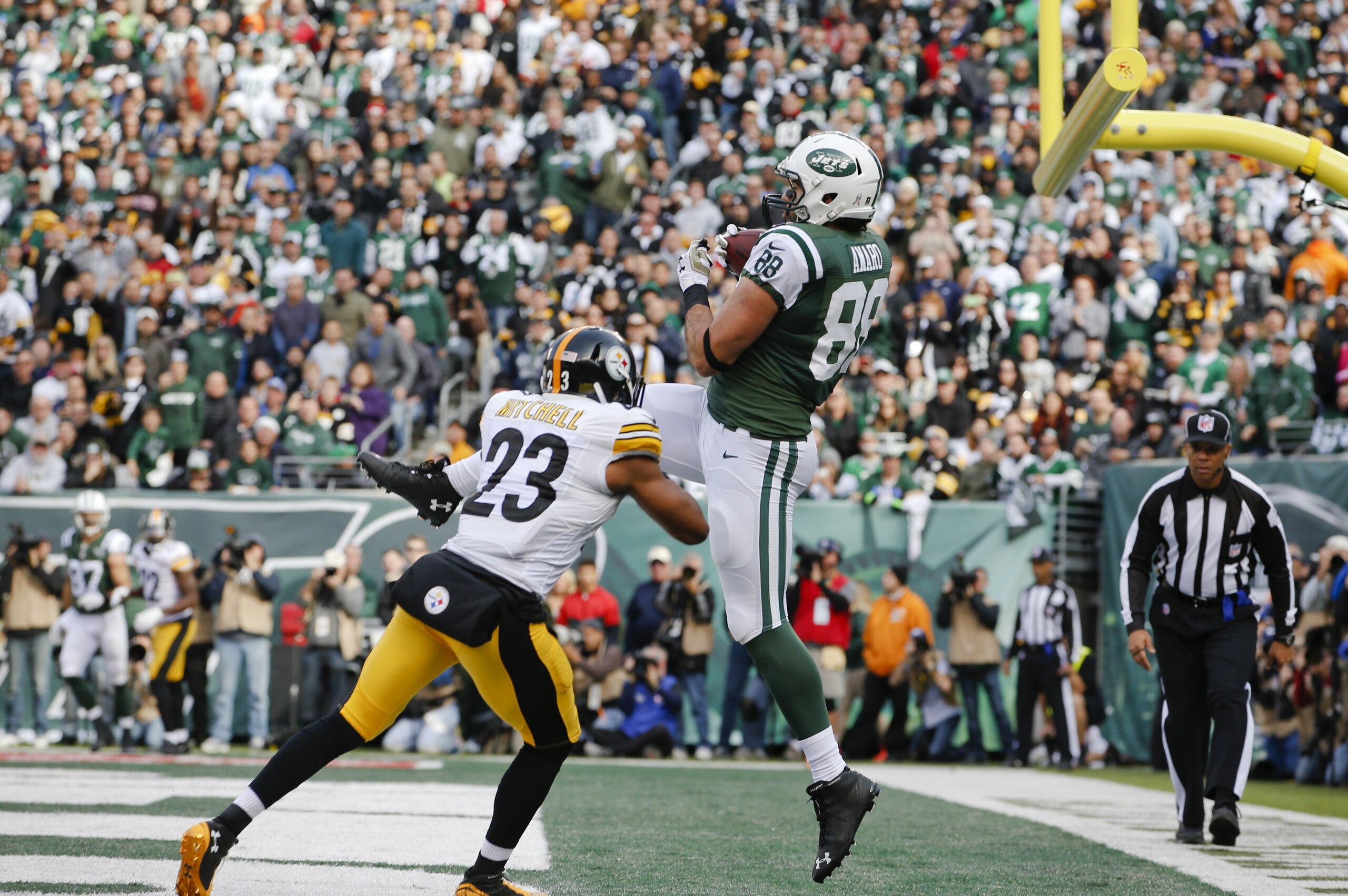 New York Jets tight end Jace Amaro (88) catches a pass for a touchdown in front of Pittsburgh Steelers' Mike Mitchell (23) during the first half of an NFL football game Sunday, Nov. 9, 2014, in East Rutherford, N.J. (AP Photo/Kathy Willens)