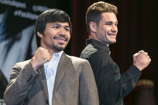 Boxers Manny Pacquiao, left, and Chris Algieri pose for a photo in Los Angeles, Wednesday, Sept. 3, 2014. They will fight for Pacquiao's WBO welterweight title at The Venetian Macao hotel on Nov. 22. (AP Photo/Damian Dovarganes)