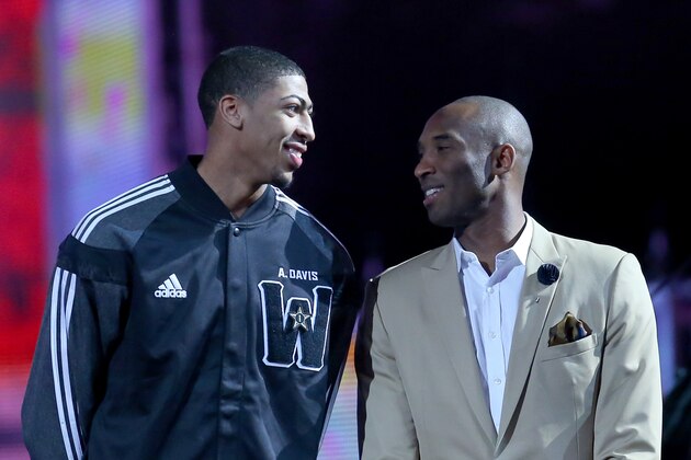 NEW ORLEANS, LA - FEBRUARY 16:  The Western Conference's Anthony Davis #23 of the New Orleans Pelicans and Kobe Bryant #24 of the Los Angeles Lakers are introduced before the 2014 NBA All-Star game at the Smoothie King Center on February 16, 2014 in New Orleans, Louisiana. NOTE TO USER: User expressly acknowledges and agrees that, by downloading and or using this photograph, User is consenting to the terms and conditions of the Getty Images License Agreement.  (Photo by Ronald Martinez/Getty Images)