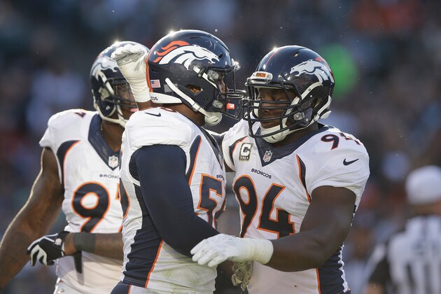 OAKLAND, CA - NOVEMBER 09:  DeMarcus Ware #94 of the Denver Broncos celebrates with teammate Von Miller #58 in the third quarter against the Oakland Raiders at O.co Coliseum on November 9, 2014 in Oakland, California.  (Photo by Ezra Shaw/Getty Images)