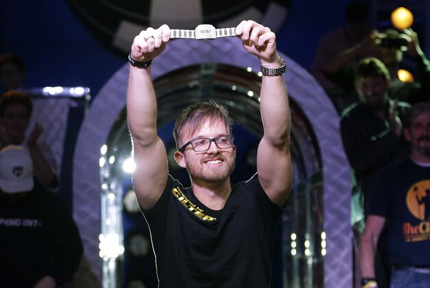Martin Jacobson holds up the World Series of Poker bracelet after winning the tournament and its $10 million prize, Tuesday, Nov. 11, 2014, in Las Vegas. (AP Photo/John Locher)