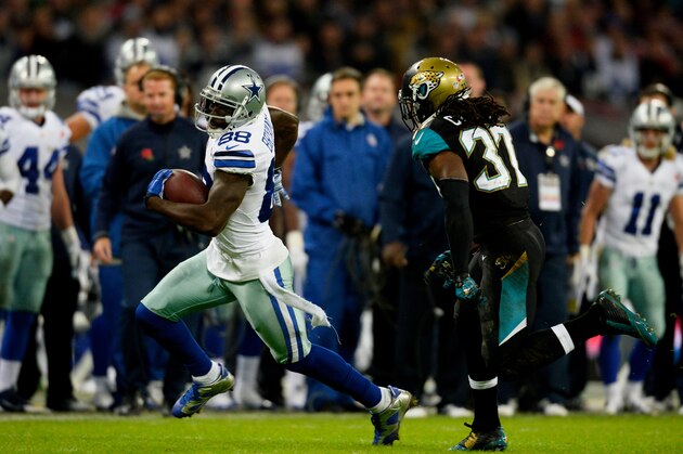 LONDON, ENGLAND - NOVEMBER 09:   Dez Bryant #88 of the Dallas Cowboys goes around the outside of Johnathan Cyprien #37 of the Jacksonville Jaguars during the NFL week 10 match between the Jackson Jaguars and the Dallas Cowboys at Wembley Stadium on November 9, 2014 in London, England.  (Photo by Alan Crowhurst/Getty Images)