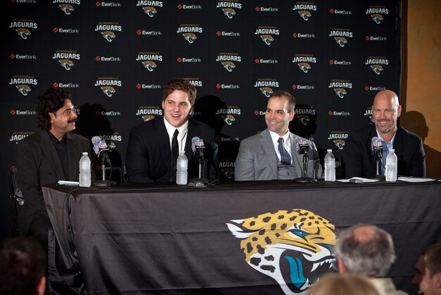 April 26, 2013; Jacksonville, FL, USA; Jacksonville Jaguars owner Shad Khan (left), newly drafted offensive lineman Luke Joeckel (second from left), general manager Dave Caldwell (second from right) and head coach Gus Bradley at a press conference held at Everbank Field. Mandatory Credit: Rob Foldy-USA TODAY Sports