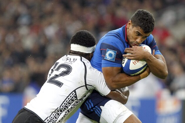 France's Wesley Fofana, right, is tackled by Fiji's Levani Botia during the rugby union test match at the Velodrome Stadium, in Marseille, southern France, Saturday, Nov. 8, 2014. (AP Photo/Claude Paris)