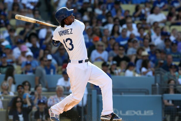 LOS ANGELES, CA - MAY 31:  Hanley Ramirez #13 of the Los Angeles Dodgers hits an RBI single in the fourth inning against the Pittsburgh Pirates at Dodger Stadium on May 31, 2014 in Los Angeles, California.  (Photo by Stephen Dunn/Getty Images)