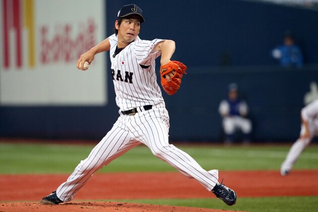 OSAKA, JAPAN - NOVEMBER 12:  Starting pitcher Kenta Maeda #18 of the Samurai Japan pitches in the first inning during the Game one of Samurai Japan and MLB All Stars at Kyocera Dome Osaka on November 12, 2014 in Osaka, Japan.  (Photo by Atsushi Tomura/Getty Images)