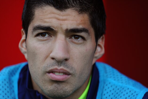 ALMERIA, SPAIN - NOVEMBER 08:   Luis Suarez of FC Barcelona  looks on from the substitutes bench during the La Liga match between UD Almeria and FC Barcelona at estadio de los Juegos Mediterraneos on November 8, 2014 in Almeria, Spain.  (Photo by Denis Doyle/Getty Images)